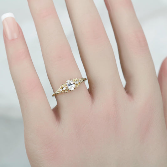 18k gold Art Nouveau leaf-band ring with an oval lab grown diamond, worn on the hand