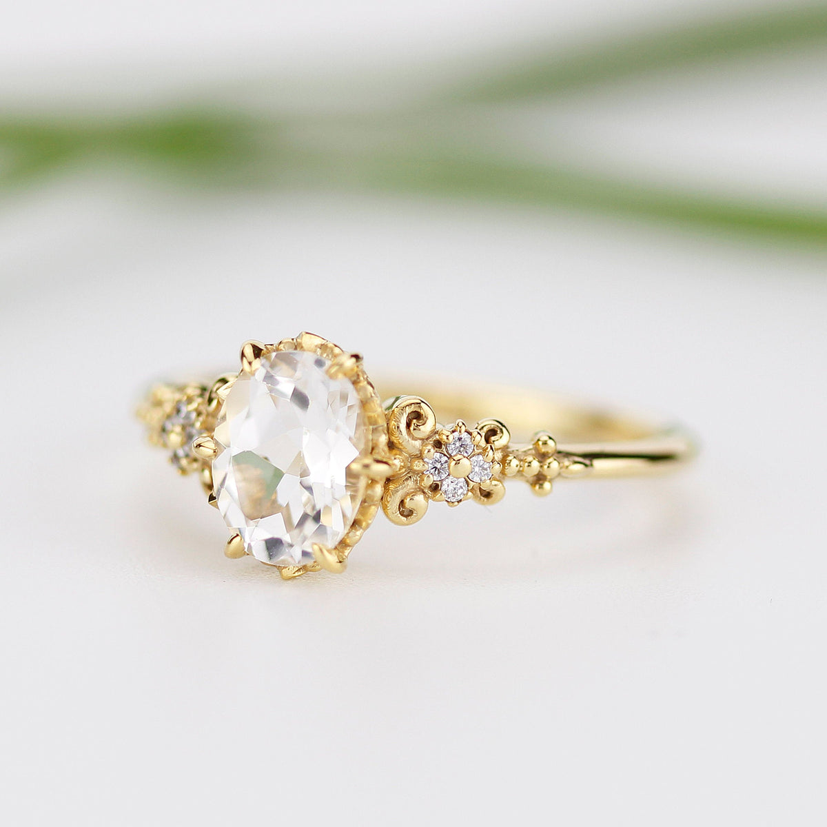 18k gold vintage ring with a 1 carat oval lab grown diamond, angled view