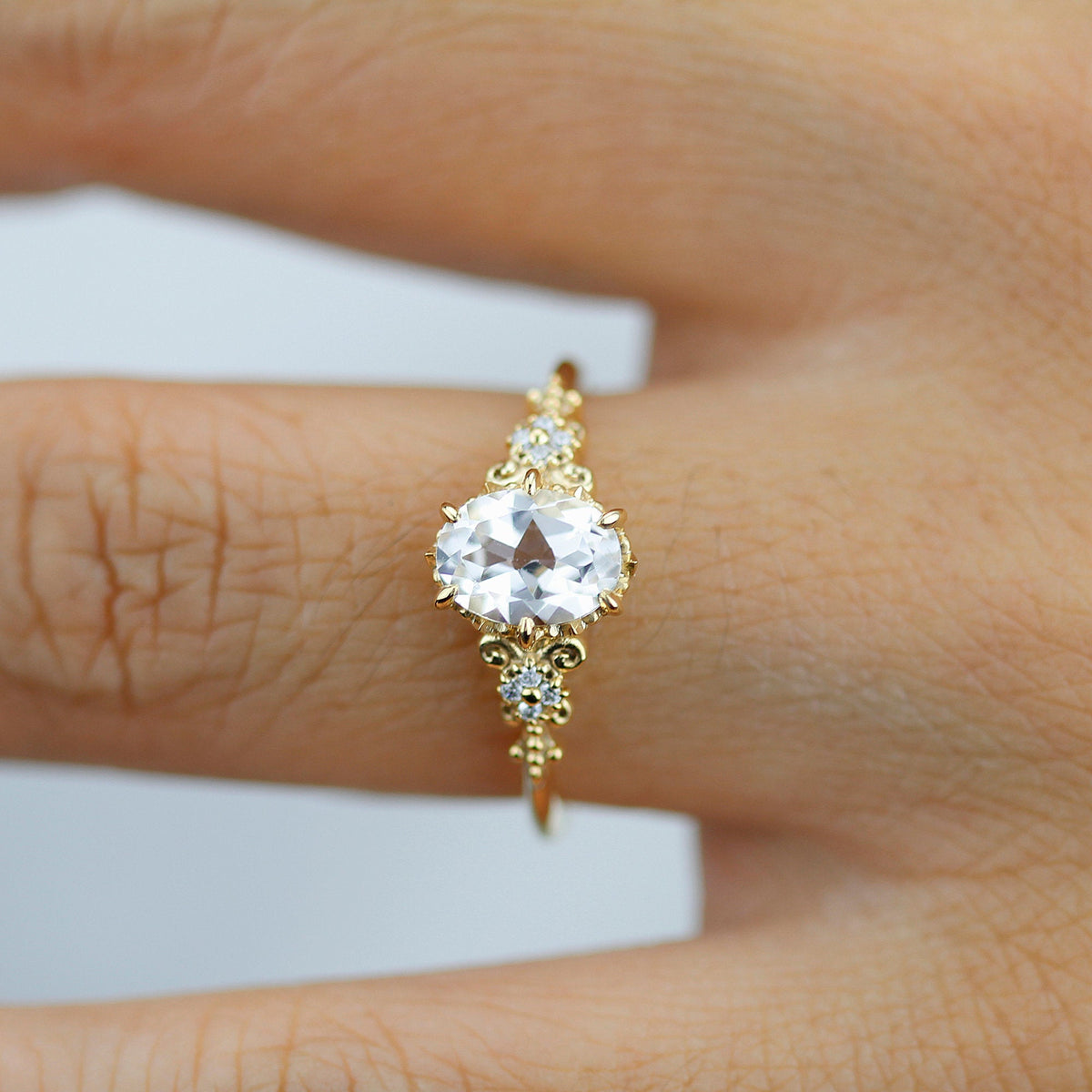 18k gold vintage ring with a 1 carat oval lab grown diamond, worn on the hand