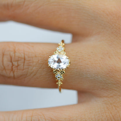 18k gold vintage ring with a 1 carat oval lab grown diamond, worn on the hand