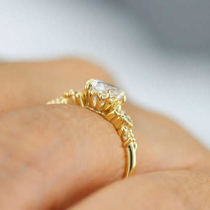 18k gold vintage ring with a 1 carat oval lab grown diamond, worn on the hand, side view