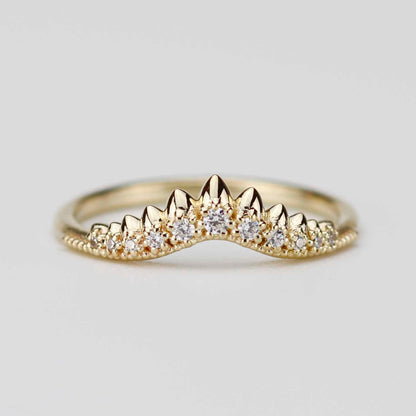 Front view of a contoured 18k yellow gold crown wedding band featuring a sunburst of natural white diamonds in a pointed chevron setting on a white background.