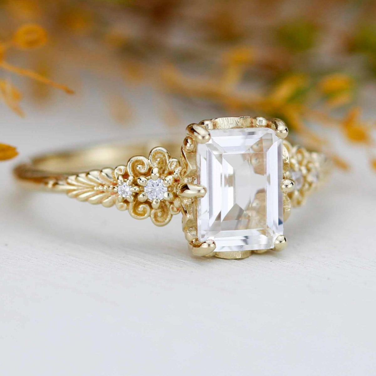 18k gold vintage floral ring with an emerald cut lab grown diamond, with dried flowers