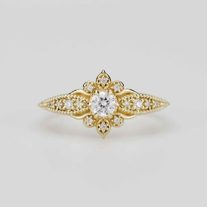 Front view of the Dhalia Mandala ring in 18k solid yellow gold, featuring a center round natural diamond surrounded by a floral mandala cluster and a tapered band with intricate gold granulation.
