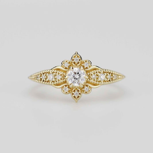 Front view of the Dhalia Mandala ring in 18k solid yellow gold, featuring a center round natural diamond surrounded by a floral mandala cluster and a tapered band with intricate gold granulation.