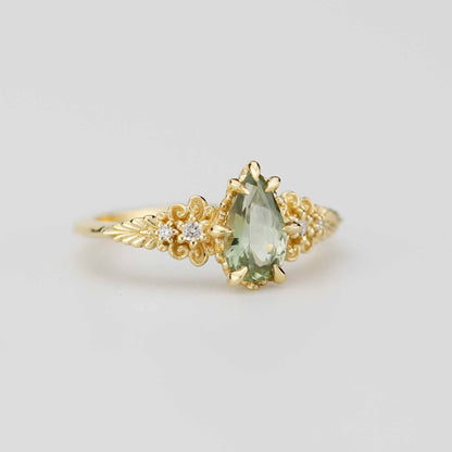 Ovaler Verlobungsring mit olivgrünem Saphir und Diamanten