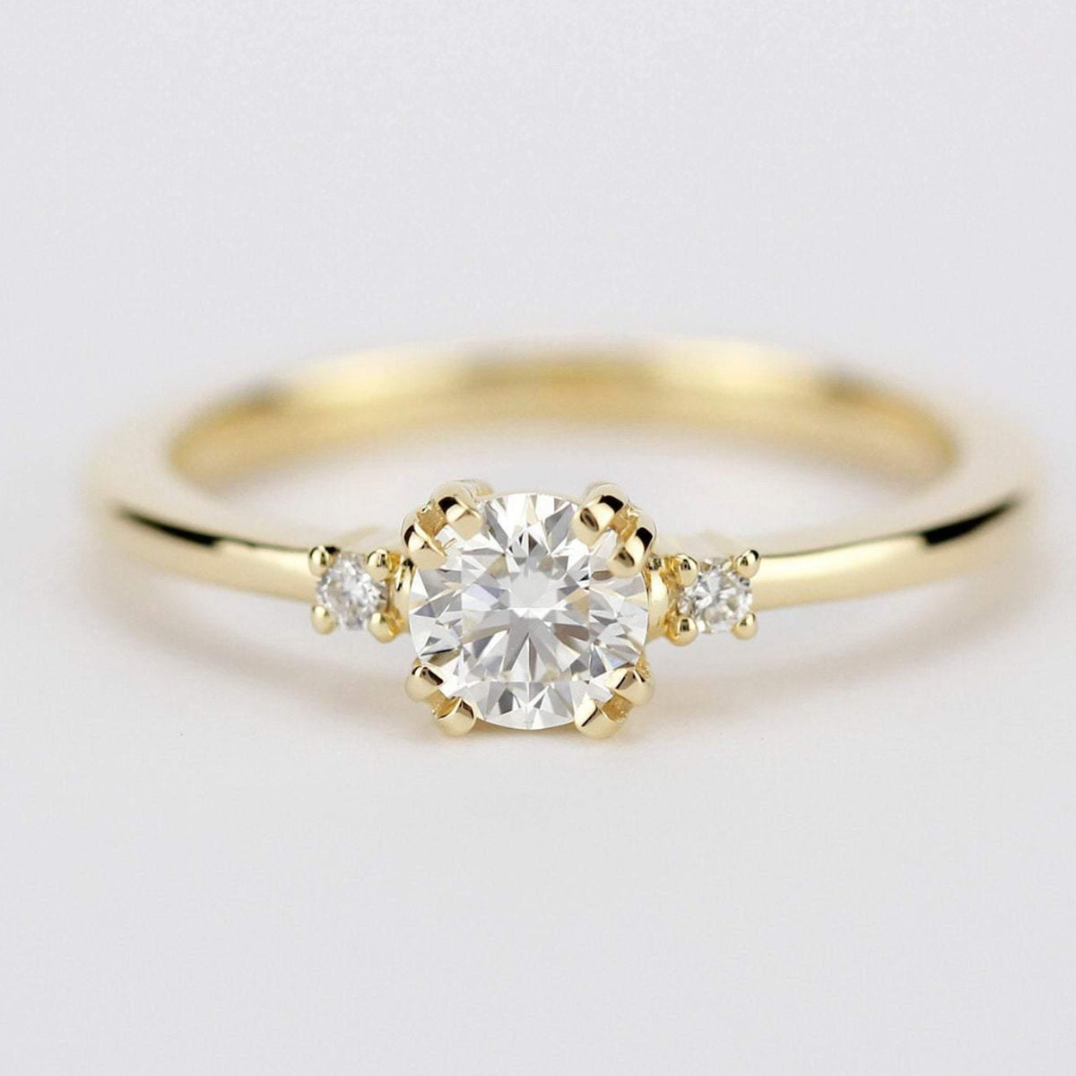 18k gold minimalist ring with a half carat, 5 mm round lab grown diamond
