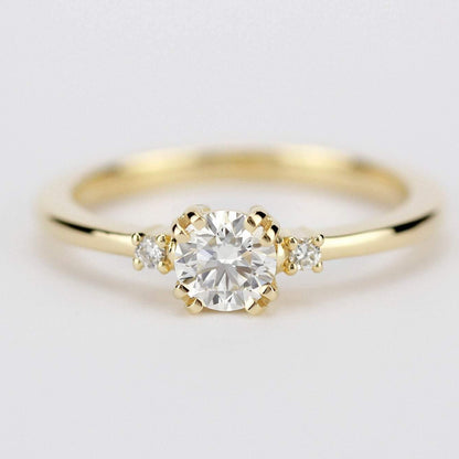 18k gold minimalist ring with a half carat, 5 mm round lab grown diamond