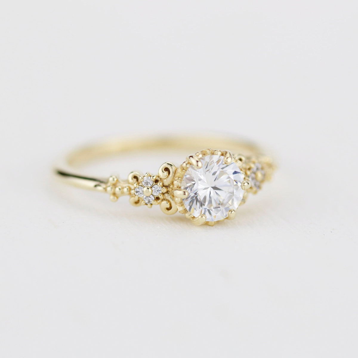 18k gold baroque cluster ring with a 0.8 carat round lab grown diamond