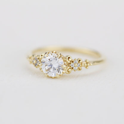18k gold baroque cluster ring with a 0.8 carat round lab grown diamond
