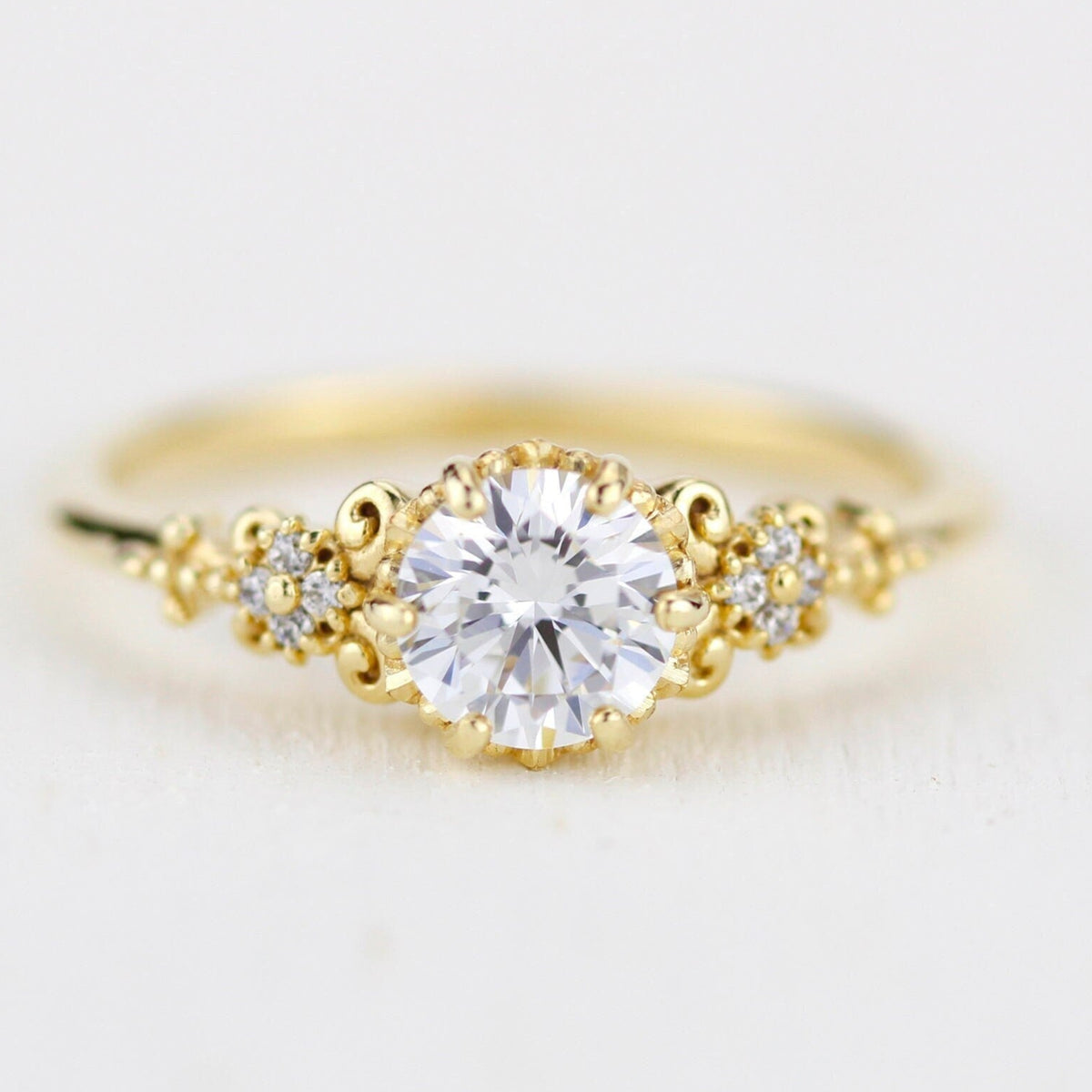 18k gold baroque cluster ring with a 0.8 carat round lab grown diamond