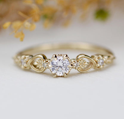Baroque 18k gold engagement ring featuring a 0.25 ct natural diamond with accent diamonds and vintage-inspired detailing