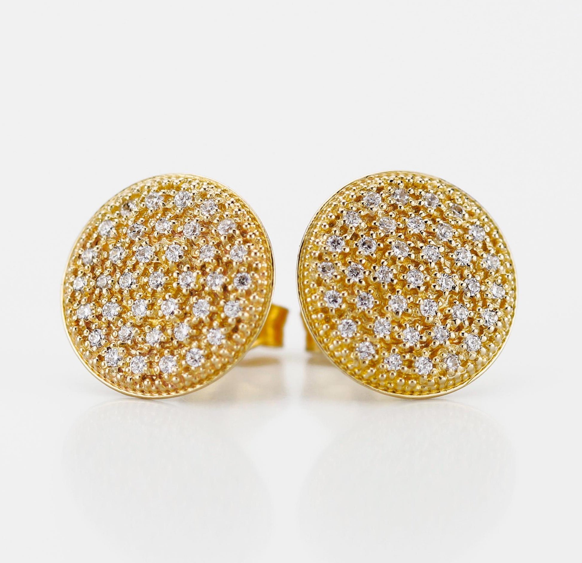 Close-up of elegant 18K solid gold round disk stud earrings, featuring 74 natural 1mm G color VS clarity diamonds in a pave setting, with a butterfly ear back