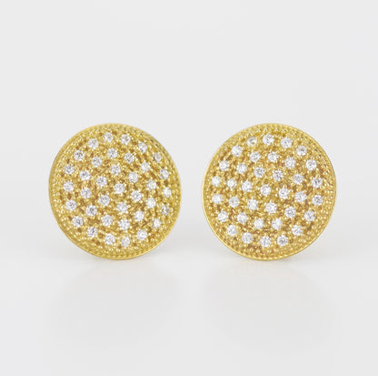Close-up of elegant 18K solid gold round disk stud earrings, featuring 74 natural 1mm G color VS clarity diamonds in a pave setting, with a butterfly ear back, sparkling against a white background