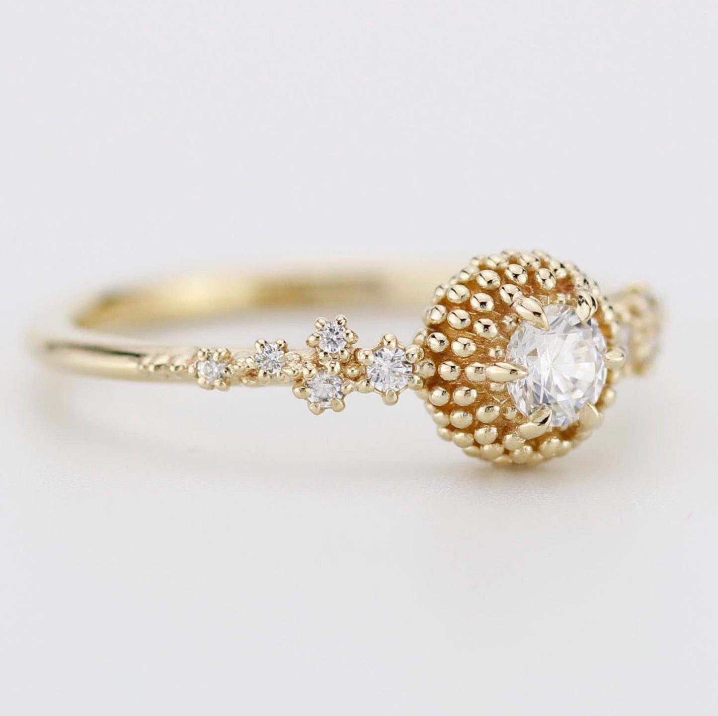 Cluster diamond engagement ring with beaded diamond detailing, crafted in 18k solid gold, inspired by the sea.