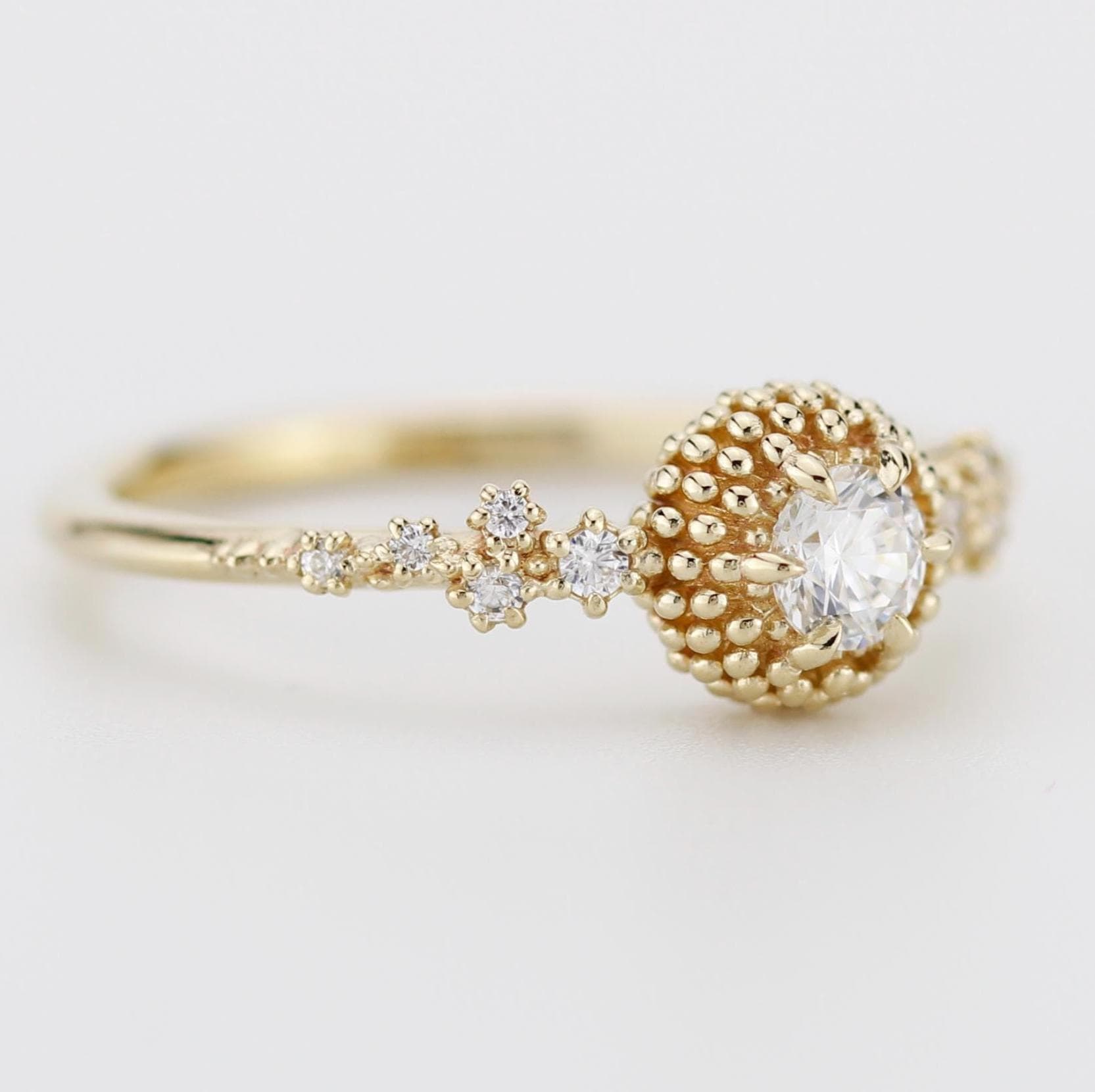 Cluster diamond engagement ring with beaded diamond detailing, crafted in 18k solid gold, inspired by the sea.