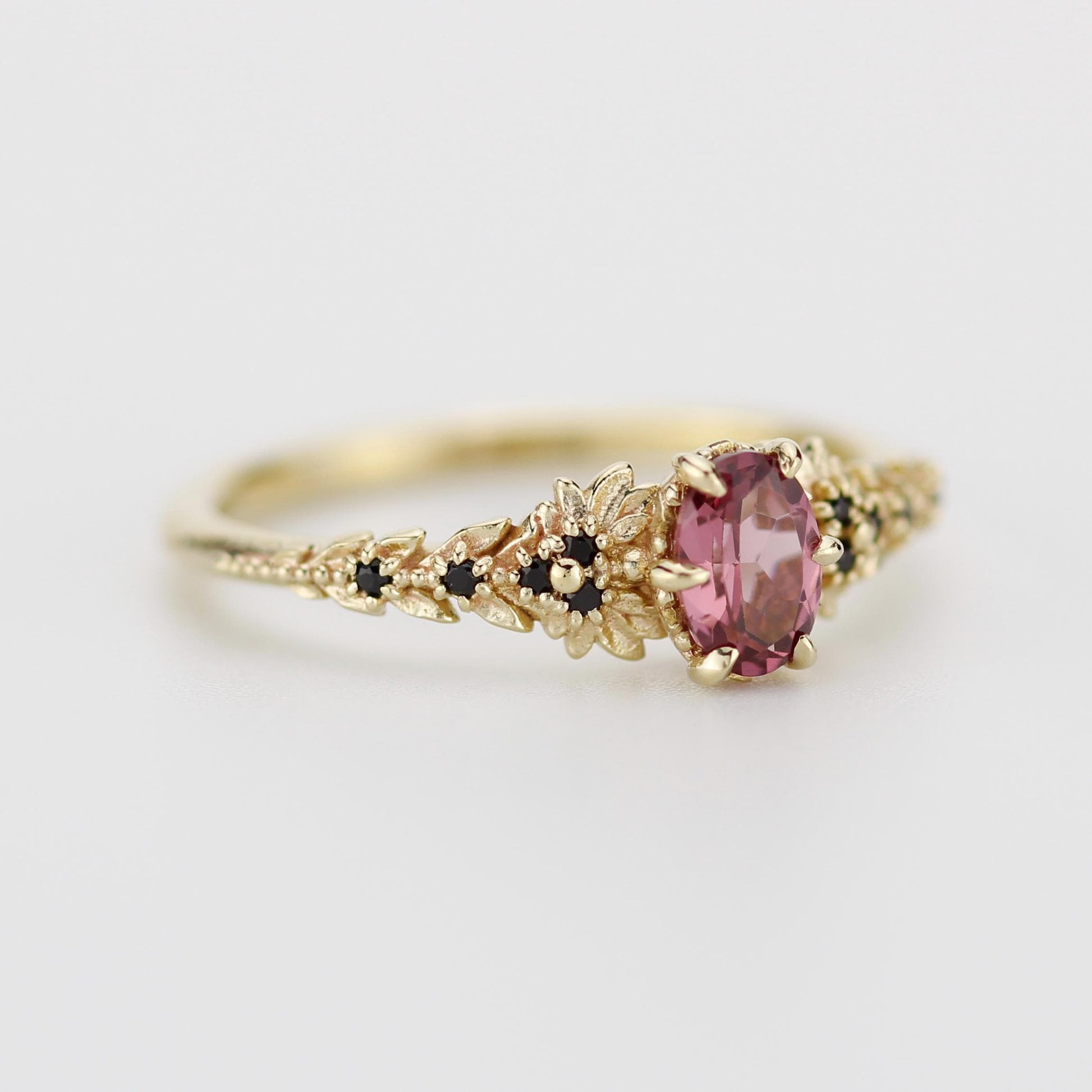 Rhodolite Garnet Engagement Ring in 18k Gold, Black Diamond Leaf Band, Oval Garnet Petal Setting, Handmade Nature-Inspired Jewelry