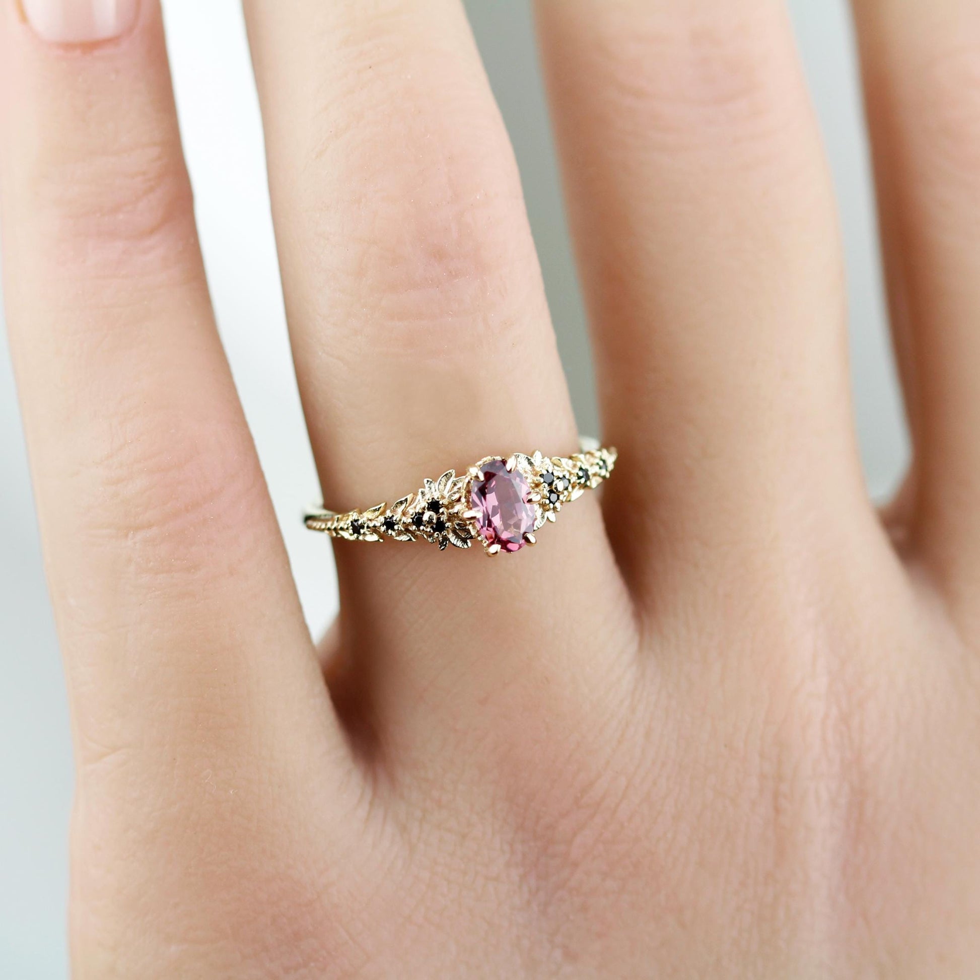 Rhodolite Garnet Engagement Ring in 18k Gold, Black Diamond Leaf Band, Oval Garnet Petal Setting, Handmade Nature-Inspired Jewelry