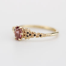 Load image into Gallery viewer, Rhodolite Garnet Engagement Ring in 18k Gold, Black Diamond Leaf Band, Oval Garnet Petal Setting, Handmade Nature-Inspired Jewelry