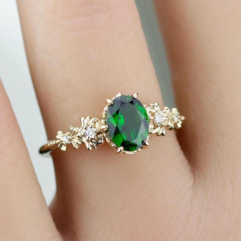 Elegant 18k solid gold ring featuring an oval natural chrome diopside center stone with floral detailing and accent diamonds on the band.