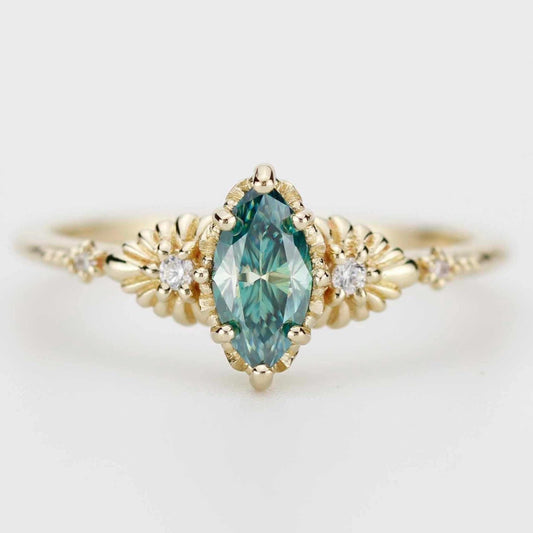Lab green moissanite marquise ring with diamonds in 18k gold