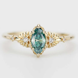 Lab green moissanite marquise ring with diamonds in 18k gold