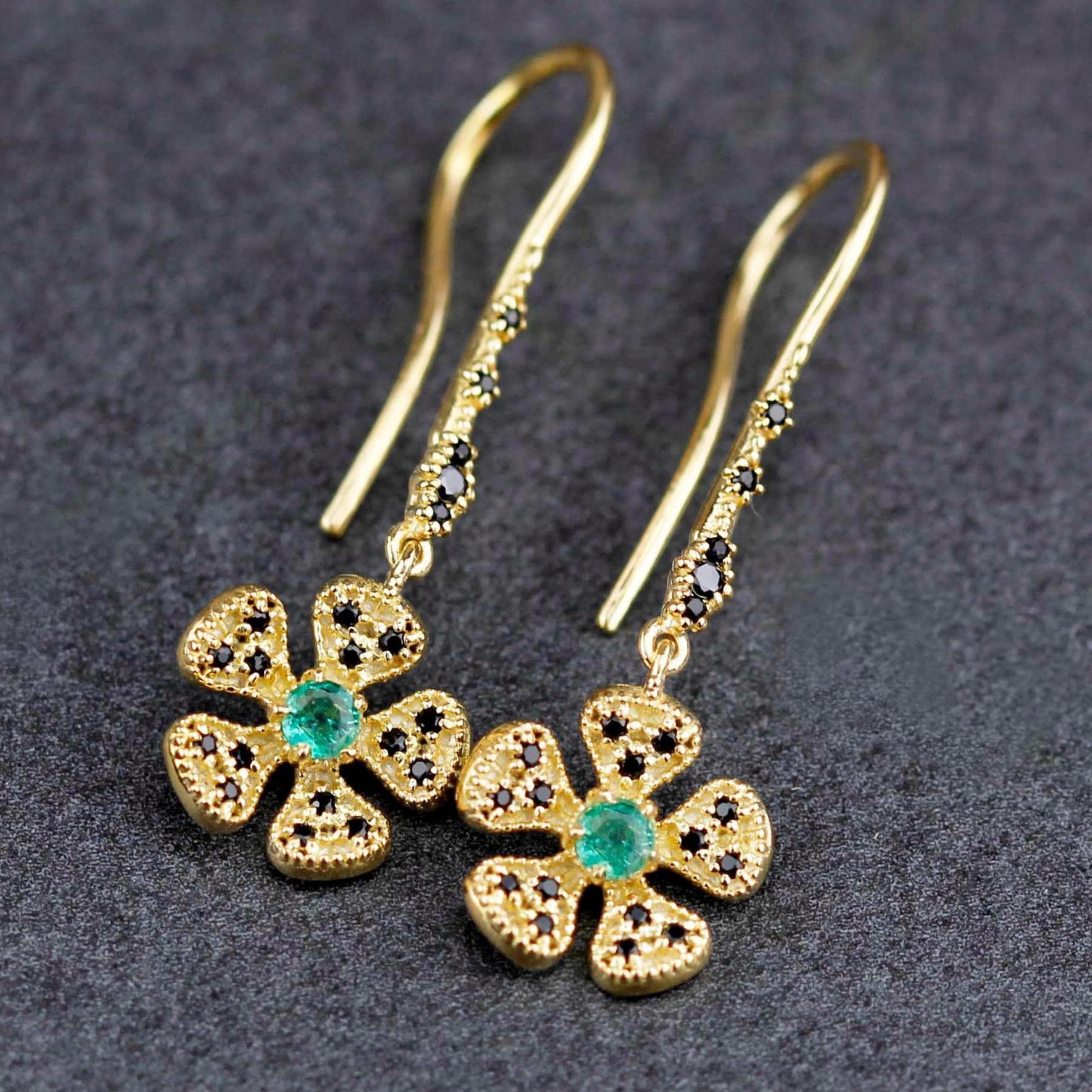 YellowGold Flower Dangle Earrings with Emeralds and Black Diamonds.