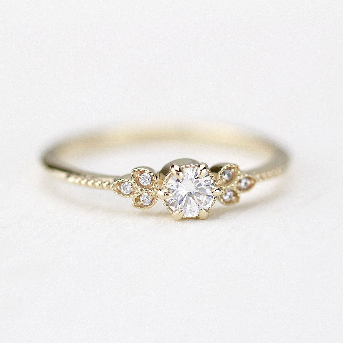 18k gold art deco leaf ring with a 4 mm round lab grown diamond, front view