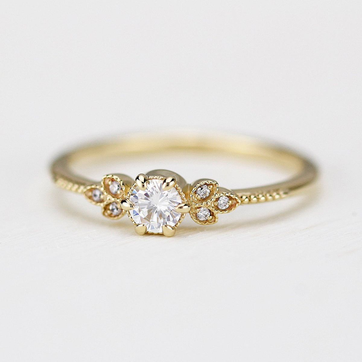 18k gold art deco leaf ring with a round lab grown diamond, front view, closer