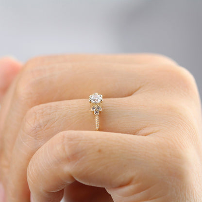 18k gold art deco leaf ring with a round lab grown diamond, profile on the hand