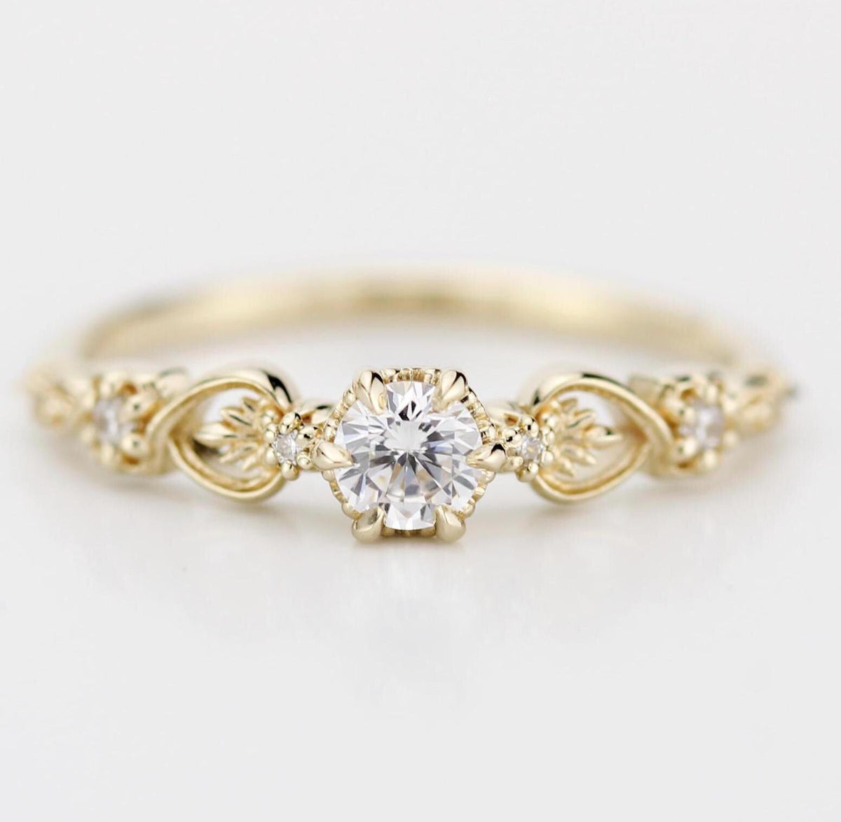 18k gold baroque scroll ring with a 4 mm round lab grown diamond