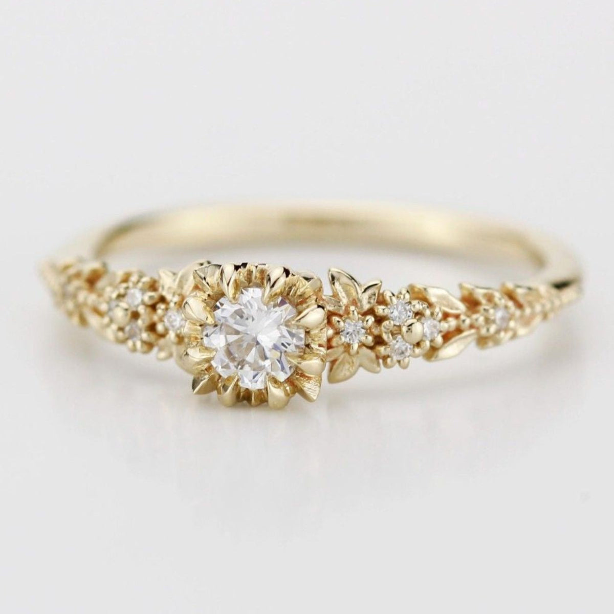 18k gold briar rose ring with a round lab grown diamond, close angled view