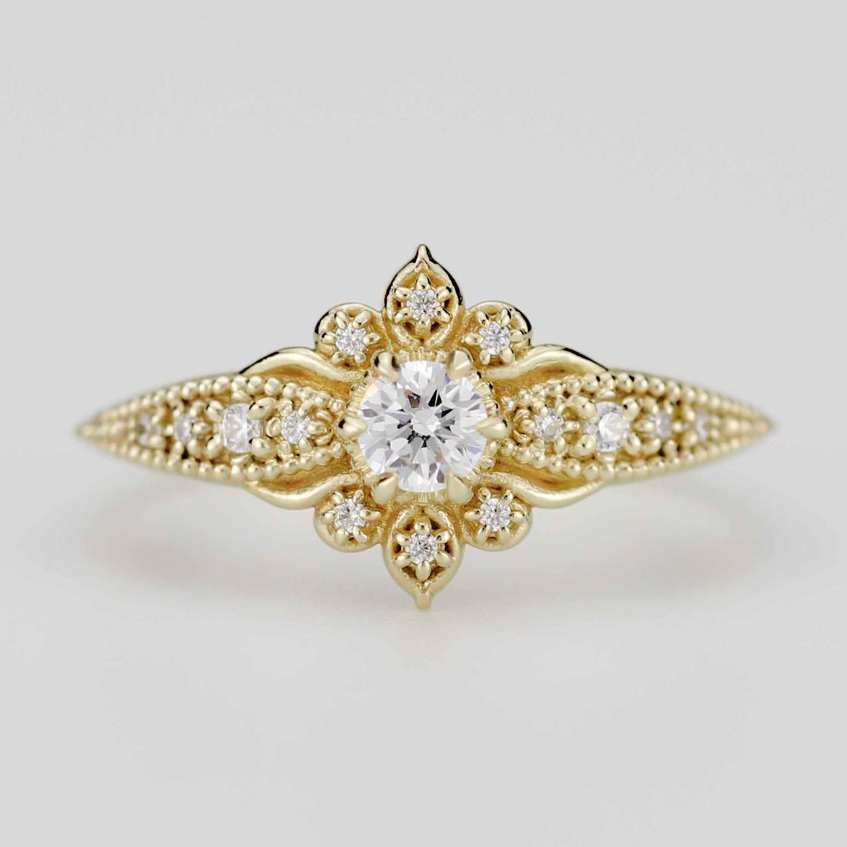 18k gold Dhalia ring with a 4 mm round lab grown diamond