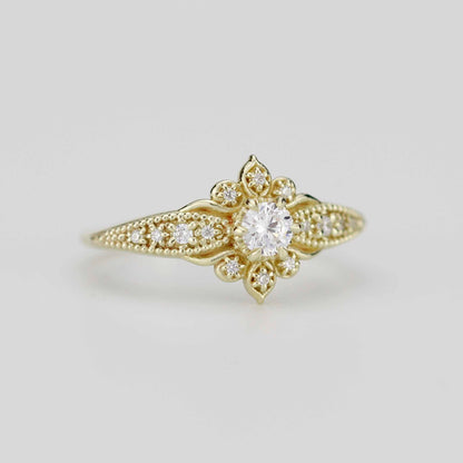 18k gold Dhalia ring with a round lab grown diamond, angled view