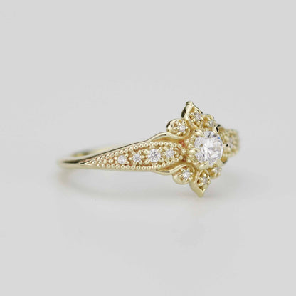 18k gold Dhalia ring with a round lab grown diamond, angled from the other side