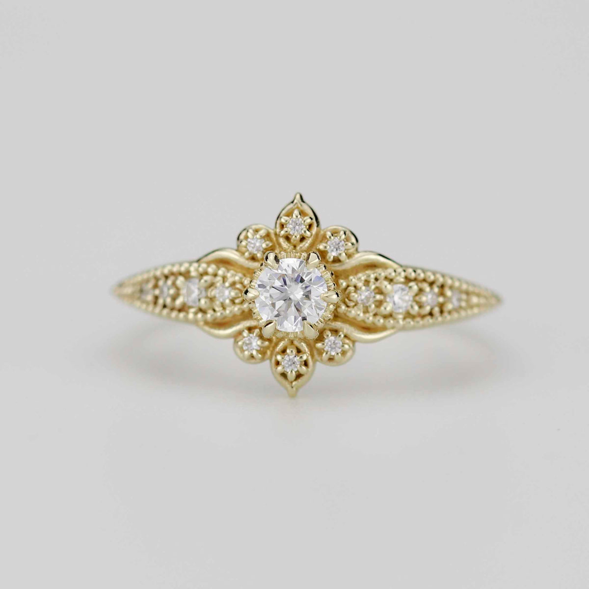 18k gold Dhalia ring with a round lab grown diamond, front view