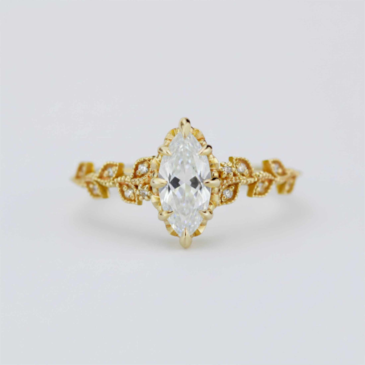 18k gold leaf ring with a 1 carat, 10x5 mm marquise lab grown diamond