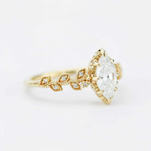 Laden Sie das Bild in den Galerie-Viewer, Certified 10x5mm Marquise Moissanite Leaf Ring | 18K Gold and Diamonds
