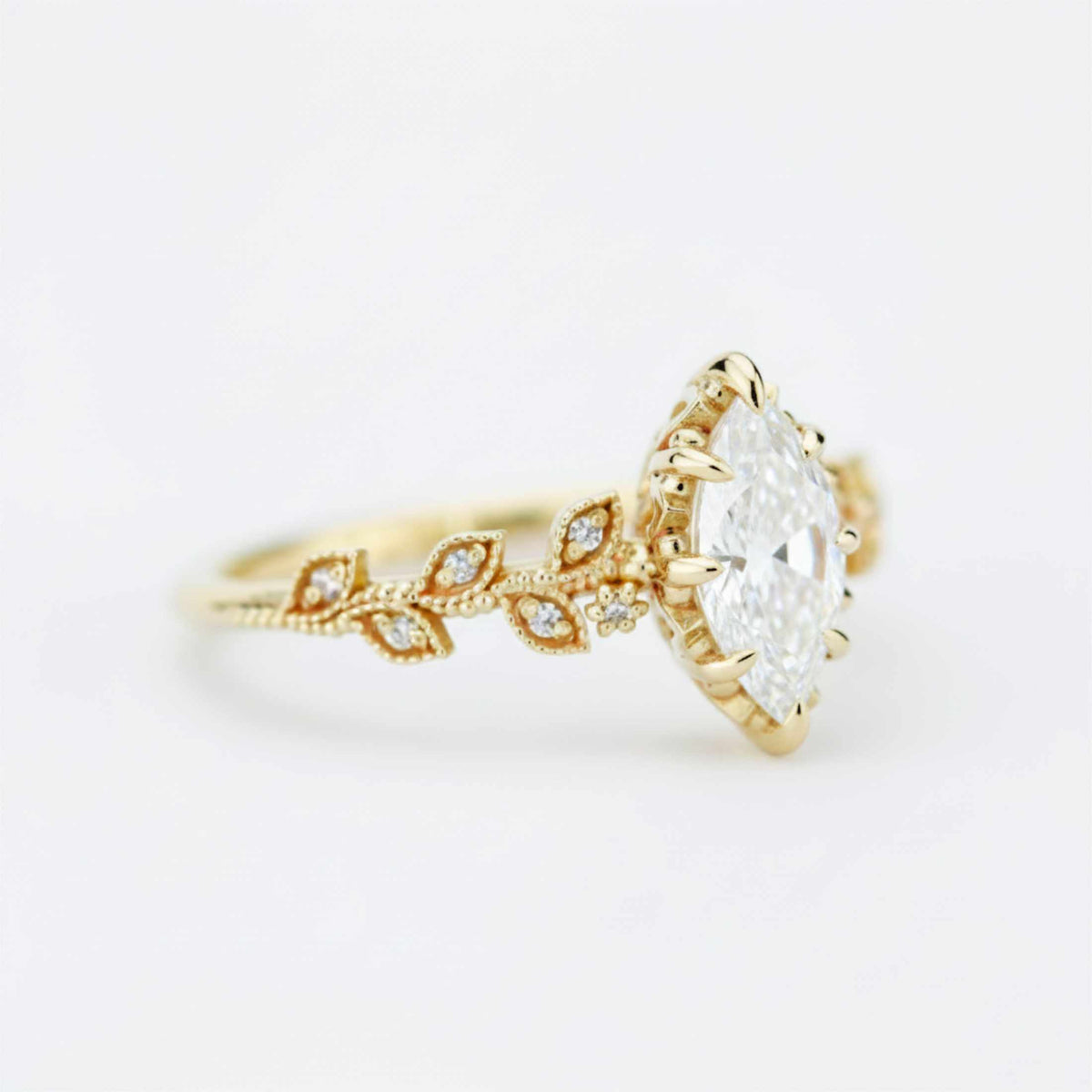 18k gold leaf ring with a 1 carat, 10x5 mm marquise lab grown diamond