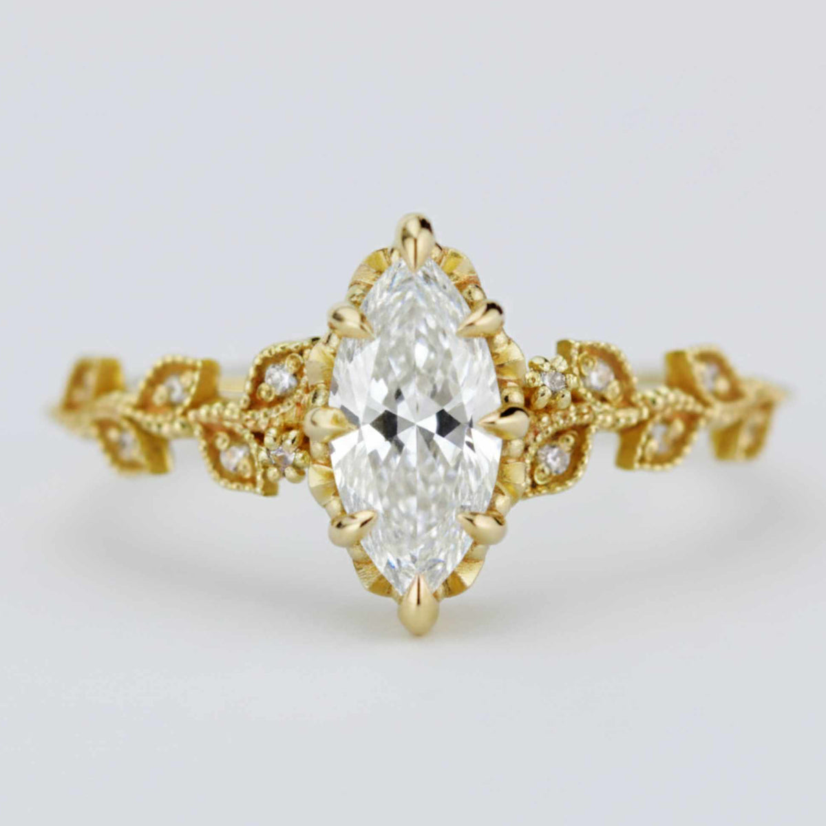 18k gold leaf ring with a 1 carat, 10x5 mm marquise lab grown diamond