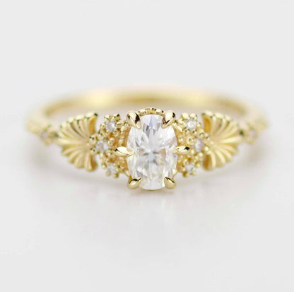 18k gold art nouveau ring with an oval lab grown diamond, about 0.45 carat, 6x4 mm