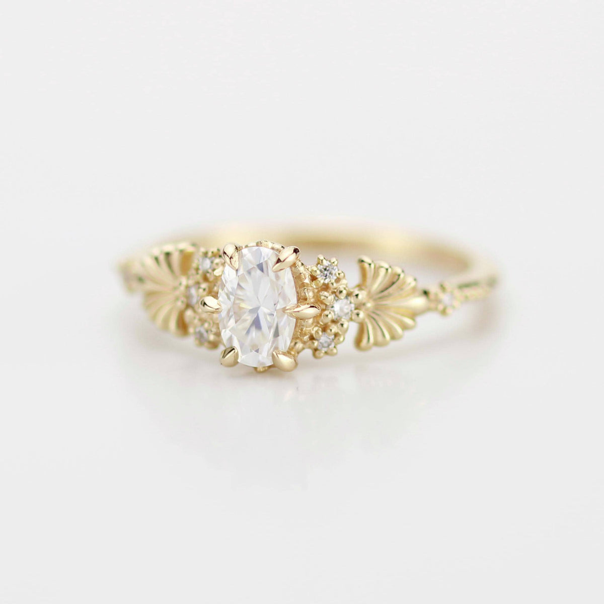 18k gold art nouveau ring with an oval lab grown diamond, angled view