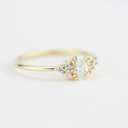 18k gold cluster ring with an oval lab grown diamond, side view