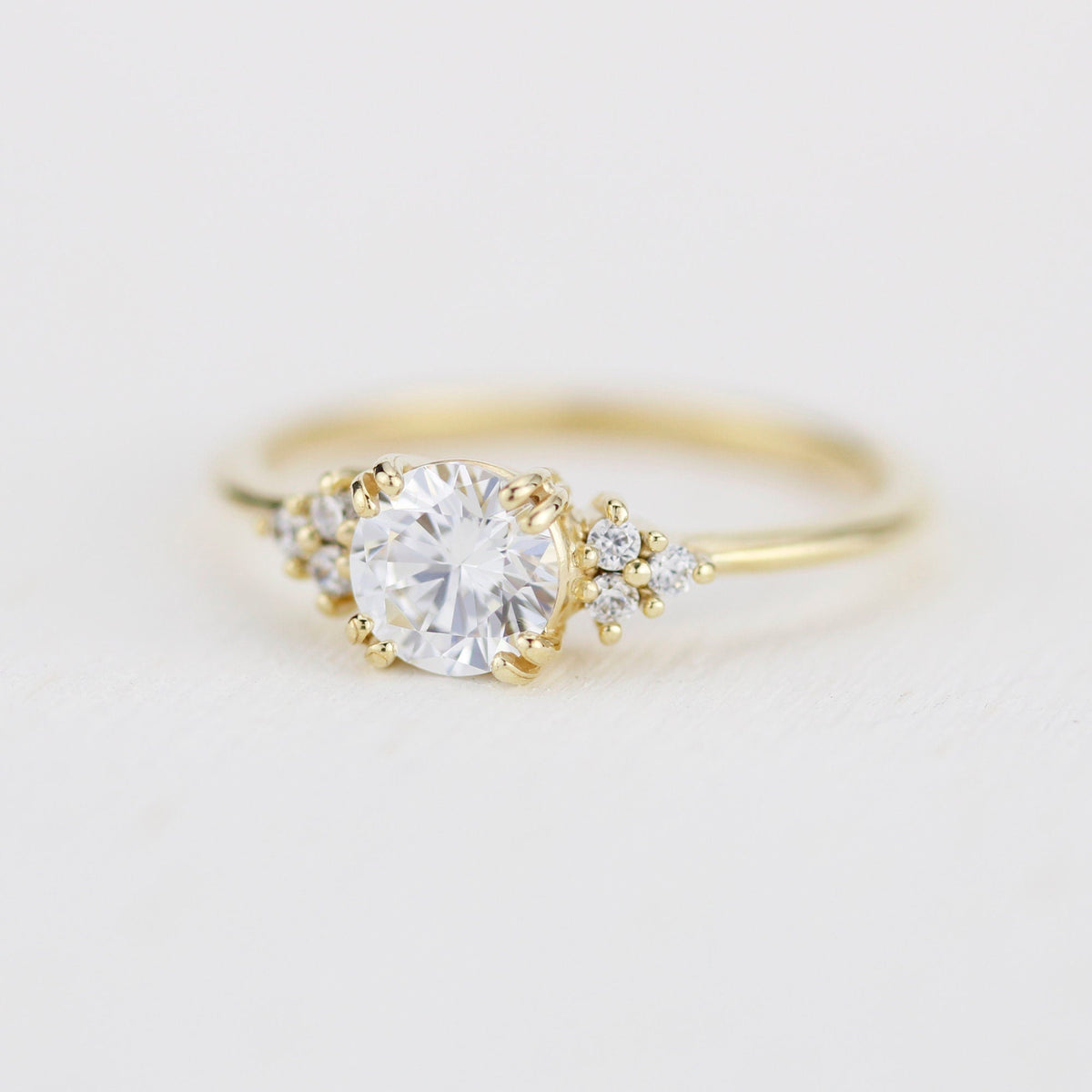 18k gold split-prong ring with a round lab grown diamond, angled from the other side