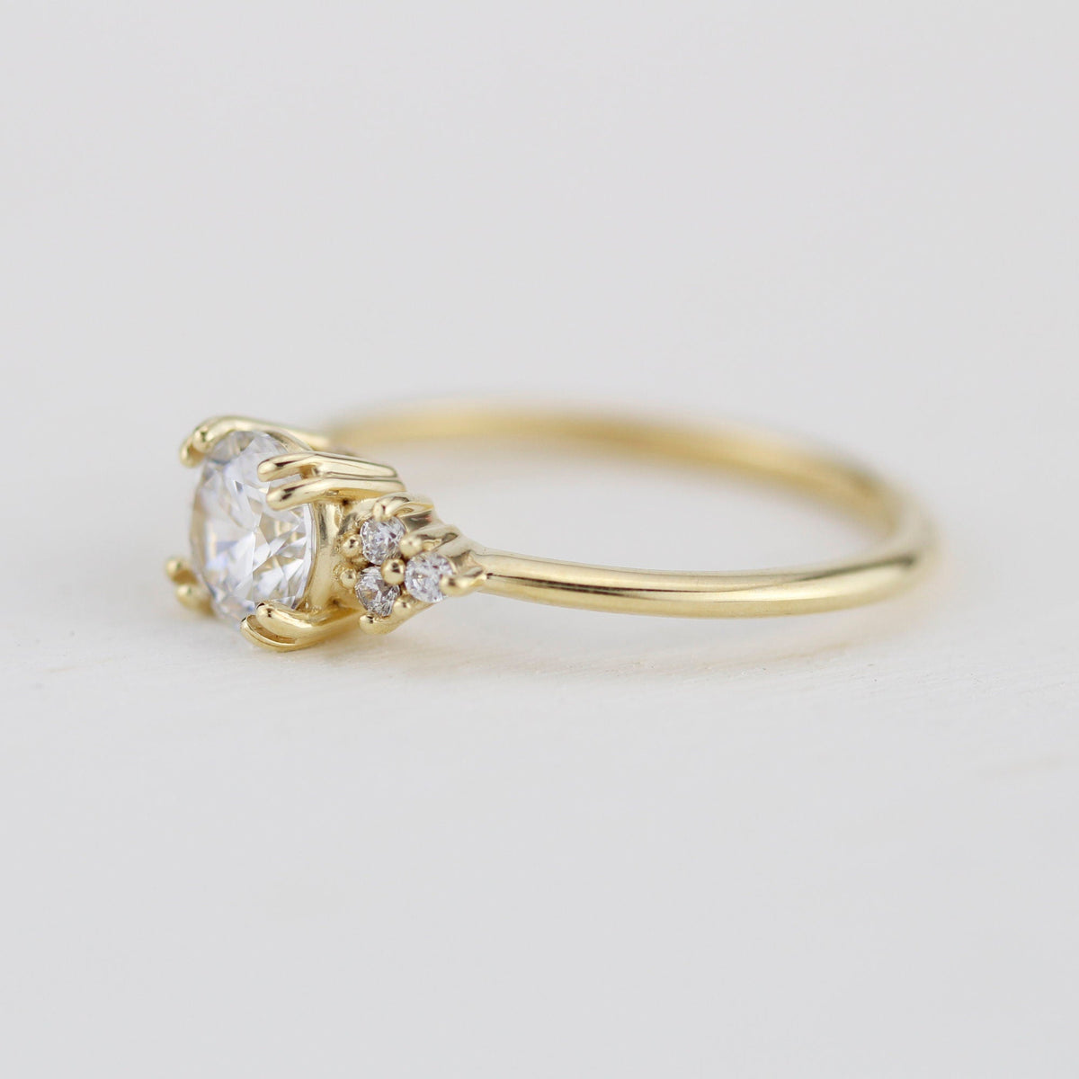 18k gold split-prong ring with a round lab grown diamond, side view