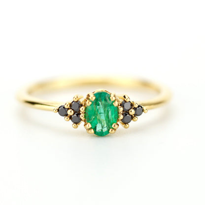 Emerald engagement ring with oval natural green emerald securely set with 8 claws 4 double claws, Natural  black diamonds as side gemstones