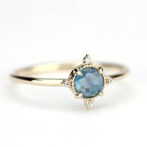 simple engagement ring compass shape ring London blue topaz and diamonds - NOOI JEWELRY
