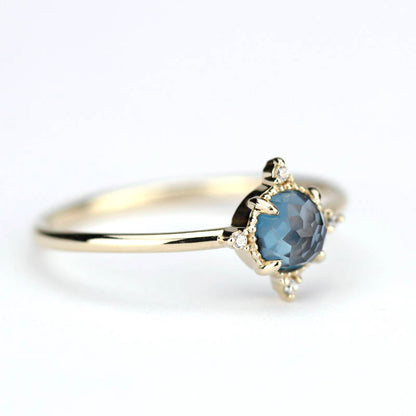 simple engagement ring compass shape ring London blue topaz and diamonds - NOOI JEWELRY
