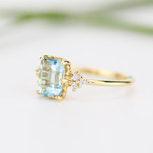 Load image into Gallery viewer, Sky blue topaz 8x6 mm emerald cut with diamonds on the side - NOOI JEWELRY