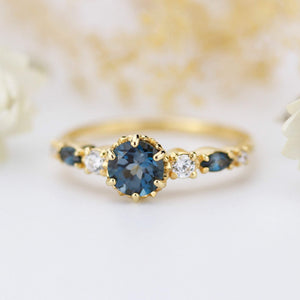 Cluster engagement ring round London blue topaz with marquise stone on the side - NOOI JEWELRY